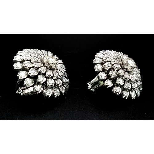 730 - A Pair of 18K White Gold 7.5ct Diamond Earrings. Floral circular design with brilliant round cut dia... 