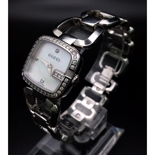 920 - A Stylish Gucci Ladies Diamond Dress Watch. Stainless steel strap and case - 25mm. Diamond bezel. Qu... 