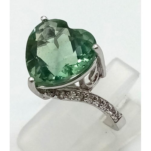 927 - A Beautiful Green Kunzite and Pale Blue Topaz Ring. Both set in 925 silver. Both size N/O.