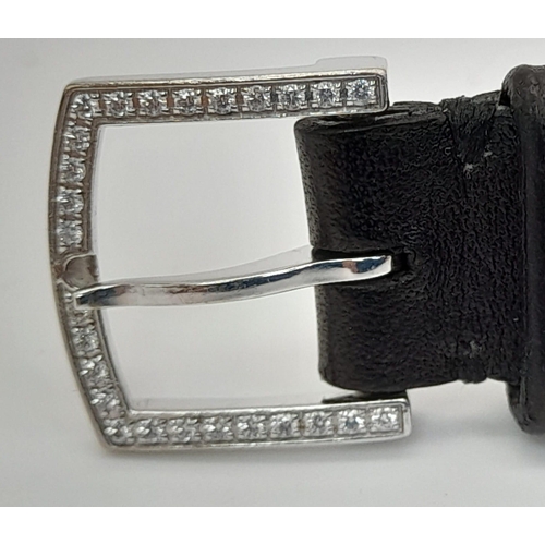 24 - A Tiffany and Co 18k White Gold and Diamond Ladies Watch. Black leather strap with Tiffany gold buck... 