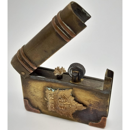 304 - A WW1 Canadian Trench Art Lighter. Made from scrap shell brass.