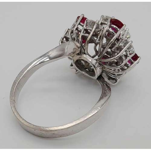 381 - An 18K White Gold Diamond and Ruby Ring. Floral design with ten brilliant round cut diamonds - 2.5ct... 