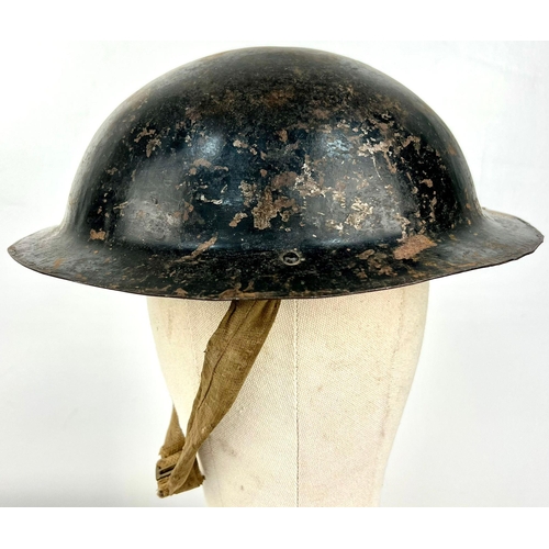 608 - A WW2 British National Fire Service Helmet. Numbered 34 for Ealing London. Complete with liner and c... 