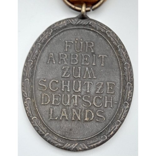 679 - A WW2 German West Wall Medal. Awarded to those who had built or served on the Siegfried Line.