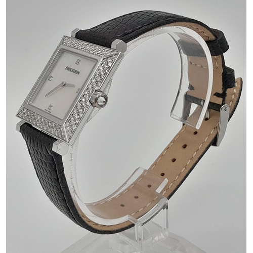 703 - A Boucheron 18K White Gold and Diamond Ladies Watch. Black leather strap. White gold and diamond cas... 