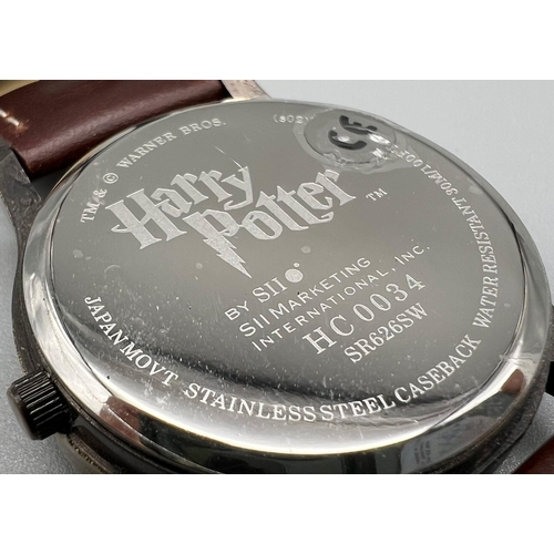 1049 - A Harry Potter stainless steel case, water resistant 30m wist watch with brown leather strap and hou... 