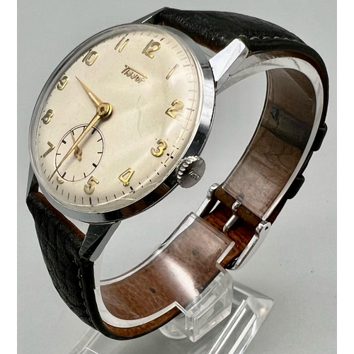 1056 - A Gents Tissot mens wrist watch with gold tone numerals and a sub dial with brown leather strap