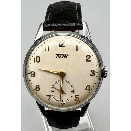 1056 - A Gents Tissot mens wrist watch with gold tone numerals and a sub dial with brown leather strap