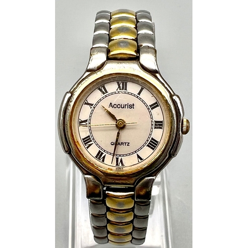 1147 - An Accurist Quartz ladies base metal and gold tone wrist watch