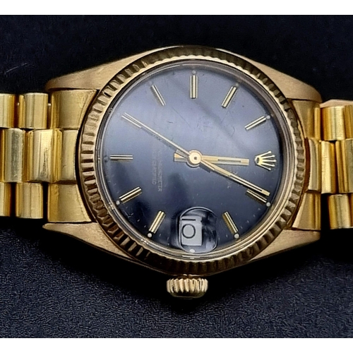 102 - An 18K Solid Gold Rolex Perpetual Datejust Ladies Watch. Gold strap and case - 31mm. Black dial. Aut... 