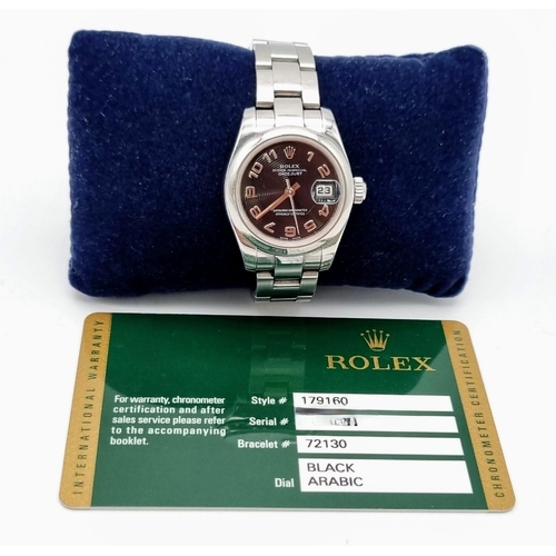 179 - A Rolex Oyster Perpetual Datejust Ladies Watch. Stainless steel strap and case - 26mm. Black hypnoti... 