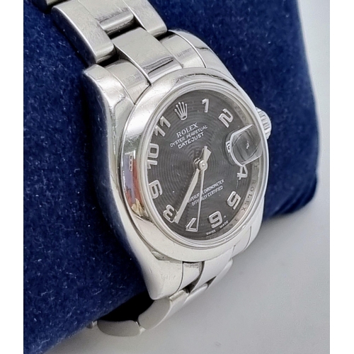 179 - A Rolex Oyster Perpetual Datejust Ladies Watch. Stainless steel strap and case - 26mm. Black hypnoti... 