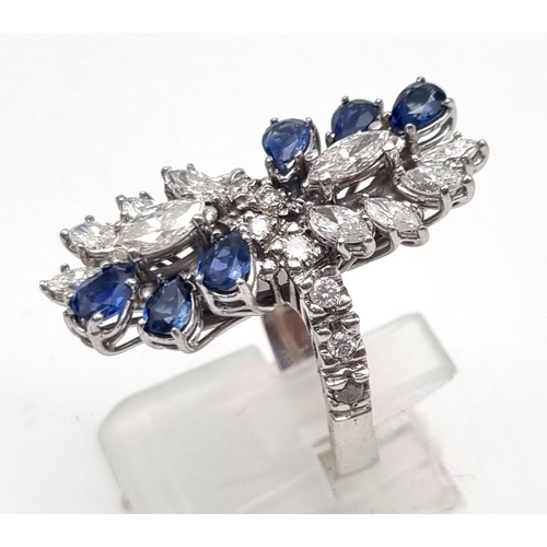 23 - A 14K White Gold Sapphire and Diamond Ladies Ring. The perfect blend of diamond and sapphires in a f... 