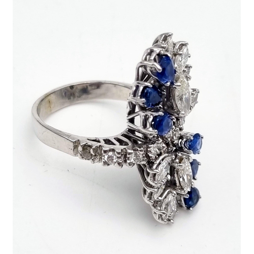 23 - A 14K White Gold Sapphire and Diamond Ladies Ring. The perfect blend of diamond and sapphires in a f... 