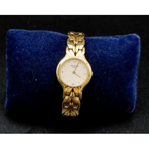 271 - A Patek Phillipe 18k Gold Ladies Watch. 18k gold strap and case - 22mm. White dial with diamonds on ... 