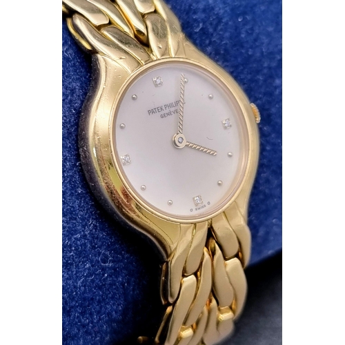 271 - A Patek Phillipe 18k Gold Ladies Watch. 18k gold strap and case - 22mm. White dial with diamonds on ... 