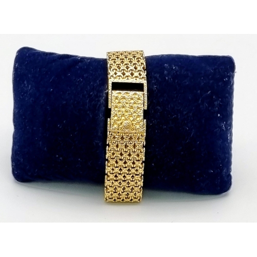 31 - A Patek Phillipe 18K Gold and Diamond Ladies Dress Watch. 18k gold mesh bracelet. Gold and diamond b... 