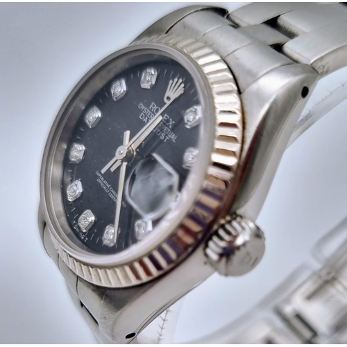 389 - A Rolex Oyster Perpetual Datejust Ladies Watch. Stainless steel strap and case - 26mm. Black dial wi... 