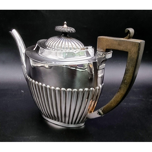 662 - A SOLID SILVER HALF FLUTED ART DECO TEA SET WITH TEA POT, SUGAR BOWL AND CREAMER IN LOVELY CONDITION... 