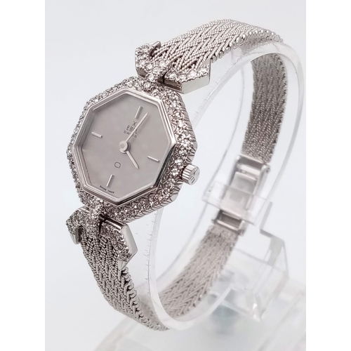 1310 - An Ebel 18k White Gold and Diamond Ladies Watch. Gold strap and hexagonal case - 22mm. Grey dial. Di... 