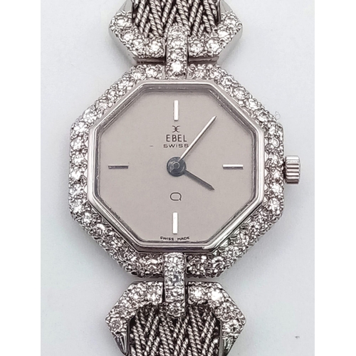 1310 - An Ebel 18k White Gold and Diamond Ladies Watch. Gold strap and hexagonal case - 22mm. Grey dial. Di... 