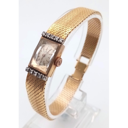 1340 - A Vintage Universal 18k Gold and Diamond Ladies Watch. Solid gold strap and case - 12 x 20mm. Diamon... 