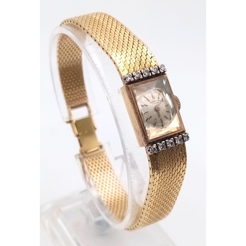 1340 - A Vintage Universal 18k Gold and Diamond Ladies Watch. Solid gold strap and case - 12 x 20mm. Diamon... 