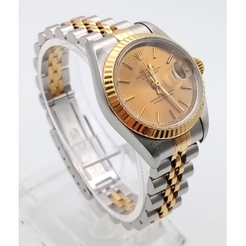 239 - A Rolex Oyster Perpetual Datejust Ladies Watch. Bi-metal jubilee strap and case - 26mm. Gold tone di... 