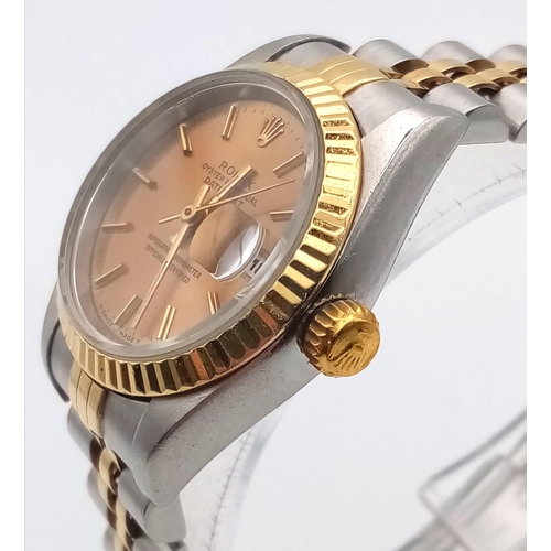 239 - A Rolex Oyster Perpetual Datejust Ladies Watch. Bi-metal jubilee strap and case - 26mm. Gold tone di... 