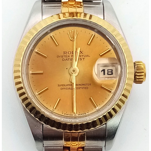 239 - A Rolex Oyster Perpetual Datejust Ladies Watch. Bi-metal jubilee strap and case - 26mm. Gold tone di... 