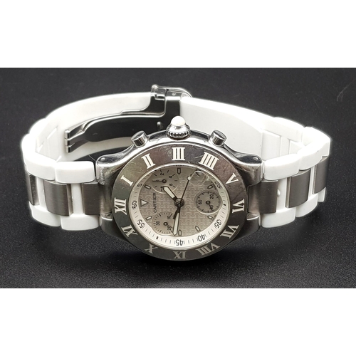 337 - A Cartier Chronograph Gents Watch. White rubber strap. Steel case - 36mm. White dial with three sub ... 