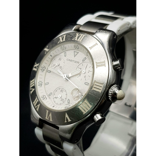 337 - A Cartier Chronograph Gents Watch. White rubber strap. Steel case - 36mm. White dial with three sub ... 