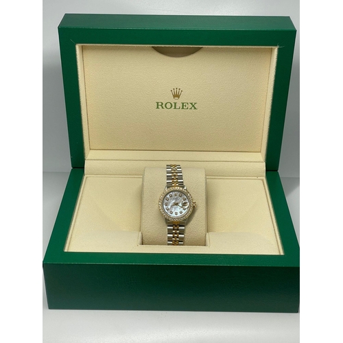 354 - A ROLEX BI-METAL LADIES 26mm DATEJUST WITH DIAMOND BEZEL ANS NUMERALS AND A MOTHER OF PEARL FACE. 19... 