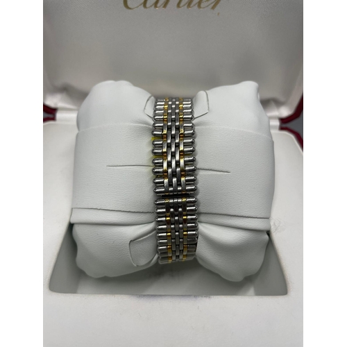 368 - A LADIES CARTIER BI-METAL ELEGANT DESIGN WRISTWATCH WITH BOX AND PAPERS.