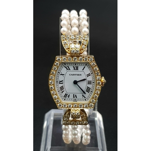 94 - A Must de Cartier 18K Gold Diamond and Pearl Ladies Watch. 
Pearl, diamond and gold bracelet. Gold a... 