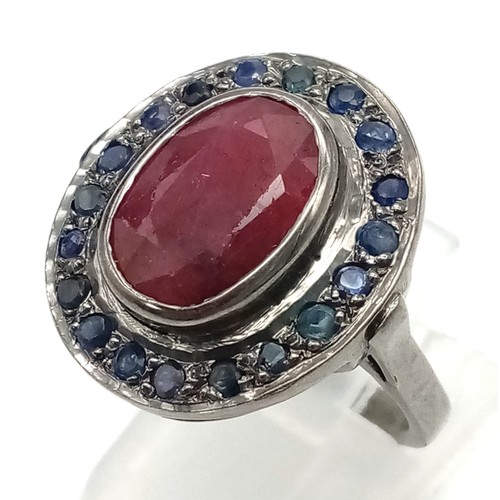 987 - A Ruby (6.3ct) Ring with Blue Sapphire Surround. 925 Sterling Silver - oxidised effect. Size N/O. Co... 