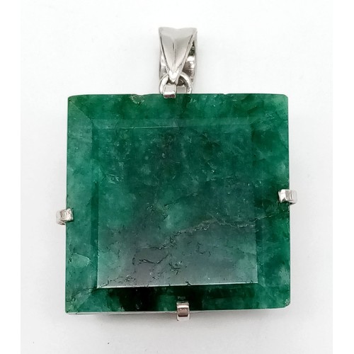 782 - An Antique-Style Large Emerald Pendant. Rectangular step cut. 925 Sterling silver. Approx 100ct. 64.... 