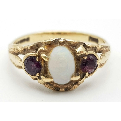 1532 - 9K Yellow Gold Opal and Garnet 3 Stone ring. Weighs 3g, Size P.