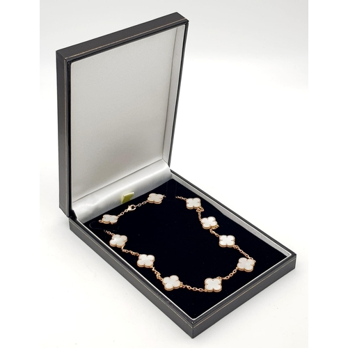 181 - A Van Cleef and Arpels Alhambra chain with 10 motifs - 18ct rose gold with mother of pearl motif ins... 