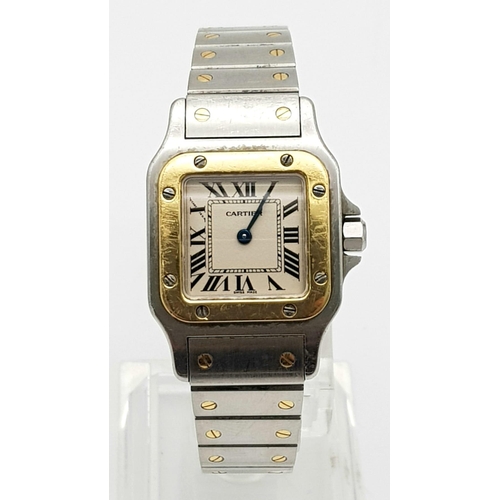 283 - A Cartier Bi-Metal Ladies Watch. Gold and stainless steel strap and case - 25mm. White dial. Quartz ... 