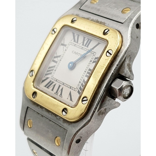 283 - A Cartier Bi-Metal Ladies Watch. Gold and stainless steel strap and case - 25mm. White dial. Quartz ... 