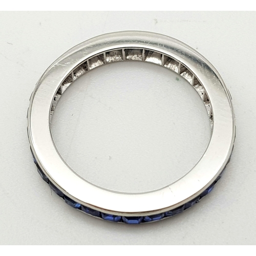 299 - A 18k White Gold Full Eternity Band with Channel Set Square Blue Sapphires. Approx. 4ct of Sapphires... 