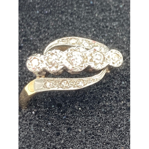 35 - Ladies antique 18 carat GOLD and DIAMOND RING in crossover style having DIAMONDS   Mounted in PLATIN... 