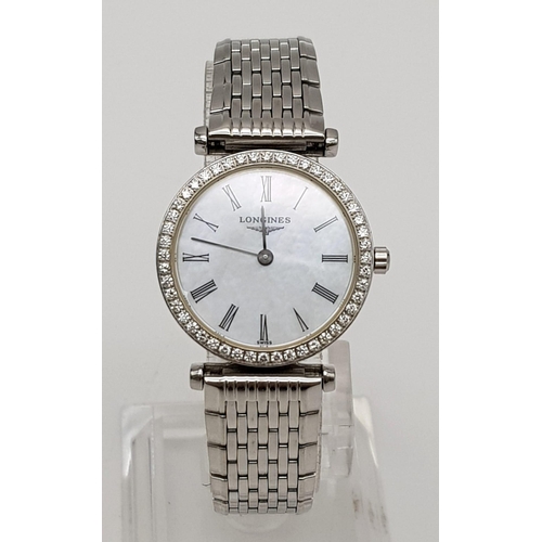 572 - A Longines Ladies Grande Classique Watch. Stainless steel strap and case - 25mm. Diamond bezel. Whit... 