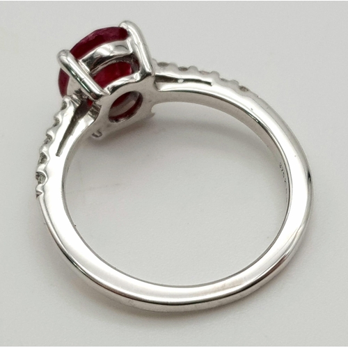 690 - 9K WHITE GOLD DIAMOND & RUBY RING WITH 1.75CT OVAL RUBY CENTRE AND  0.15CT DIAMONDS SET ON BOTH SIDE... 