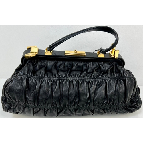 220 - A Prada Black Gaufre Large Leather Hand Bag. Gilded hardware. Zipped inner compartment. 42 x 25cm. R... 