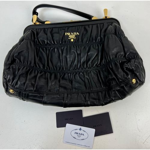 220 - A Prada Black Gaufre Large Leather Hand Bag. Gilded hardware. Zipped inner compartment. 42 x 25cm. R... 