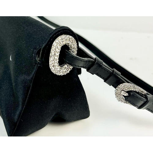 234 - A Jimmy Choo Black Clutch/Small Handbag. Silver tone and white stone hardware. Zipped inner compartm... 