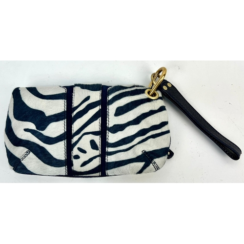 241 - A Jimmy Choo Zebra Stripe Large Clutch Bag. Gilded hardware. Zipped inner and outer compartment. Dus... 