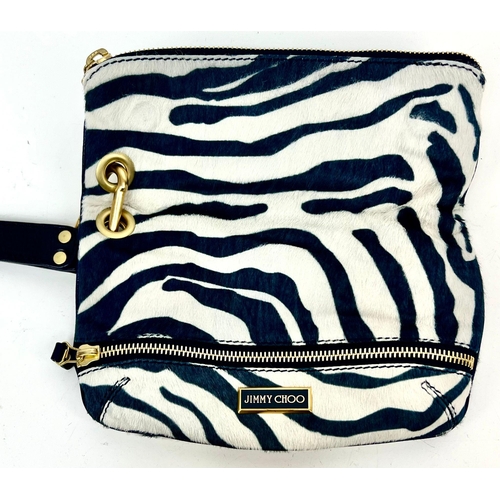 241 - A Jimmy Choo Zebra Stripe Large Clutch Bag. Gilded hardware. Zipped inner and outer compartment. Dus... 